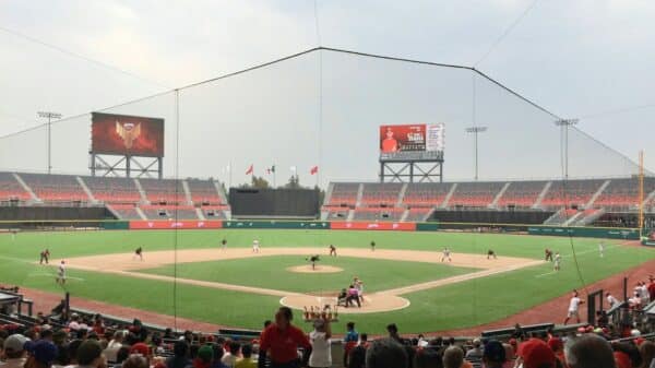 a baseball game is being played on a cloudy day
