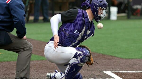 time-lapse photography of baseball about to hit baseball catcher