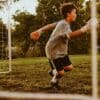boy playing soccer